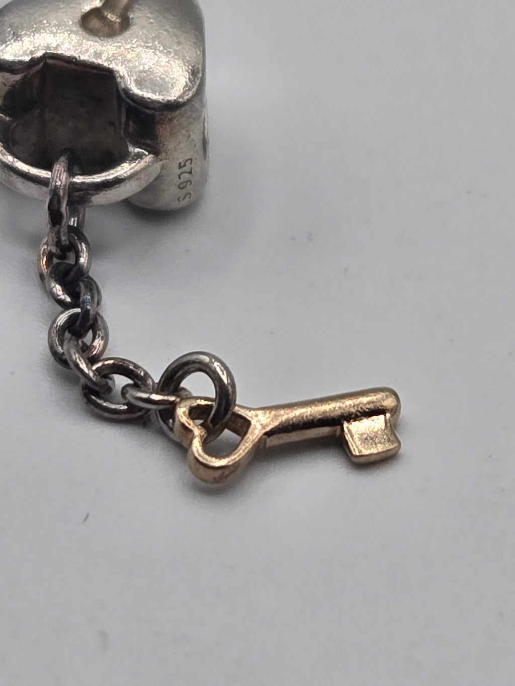 Preloved Pandora Two Tone Heart Lock and Key Charm, S925 ALE sterling silver and 14K gold, side view