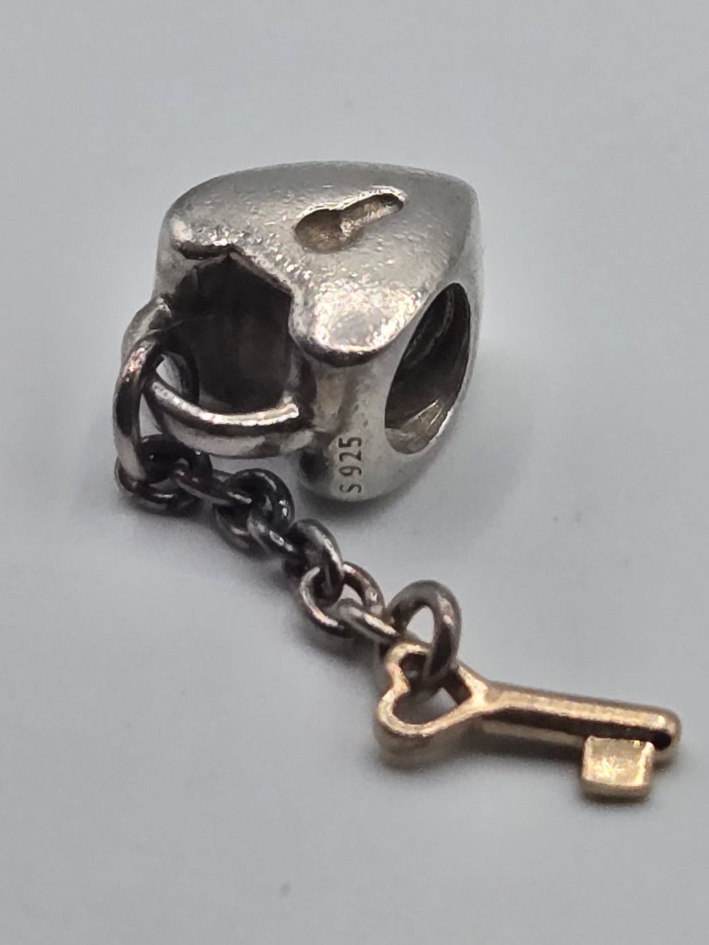 Preloved Pandora Two Tone Heart Lock and Key Charm, S925 ALE sterling silver and 14K gold, close up