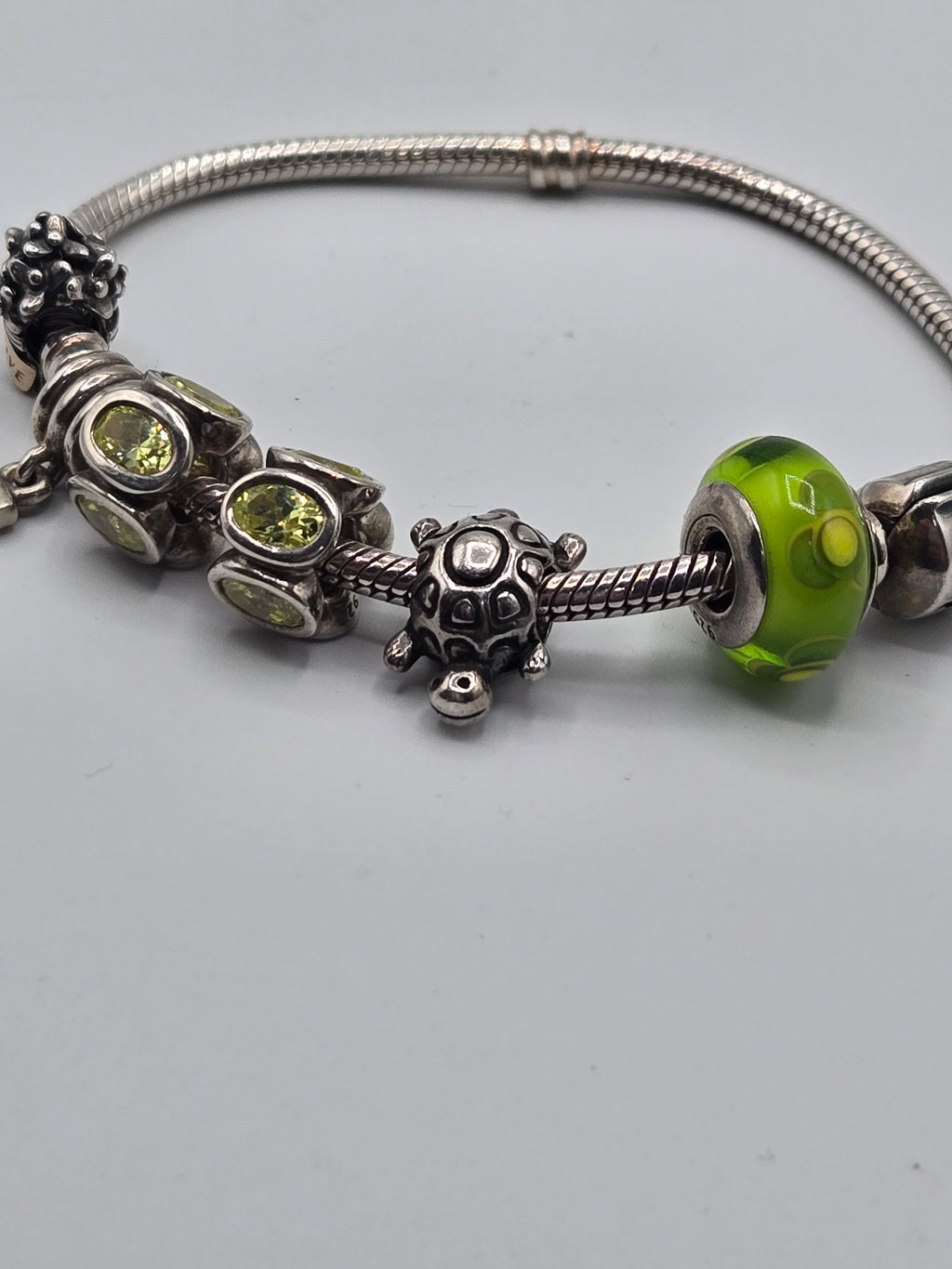 Preloved Pandora Bracelet with 6 Charms 18.5cm, S925 ALE sterling silver with a two tone 14K charm, close up