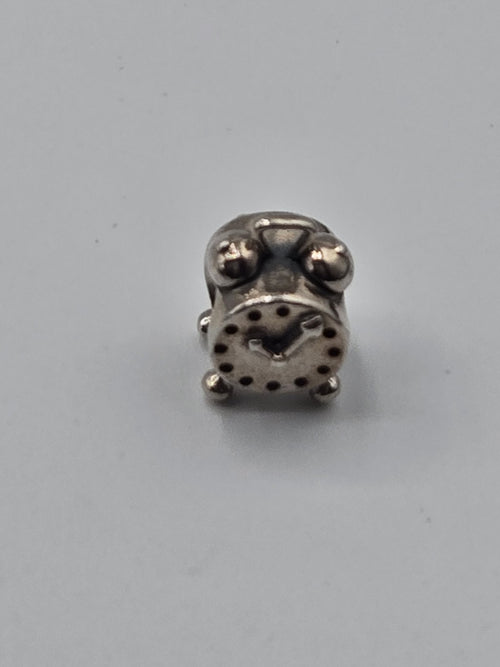 Pandora Alarm Clock Charm on a plain light background