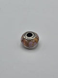Pandora Amber and Lilac Flower Murano Glass Charm on a plain light background