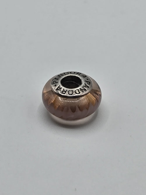 Pandora Amber Glow Murano Glass Charm on a plain light background