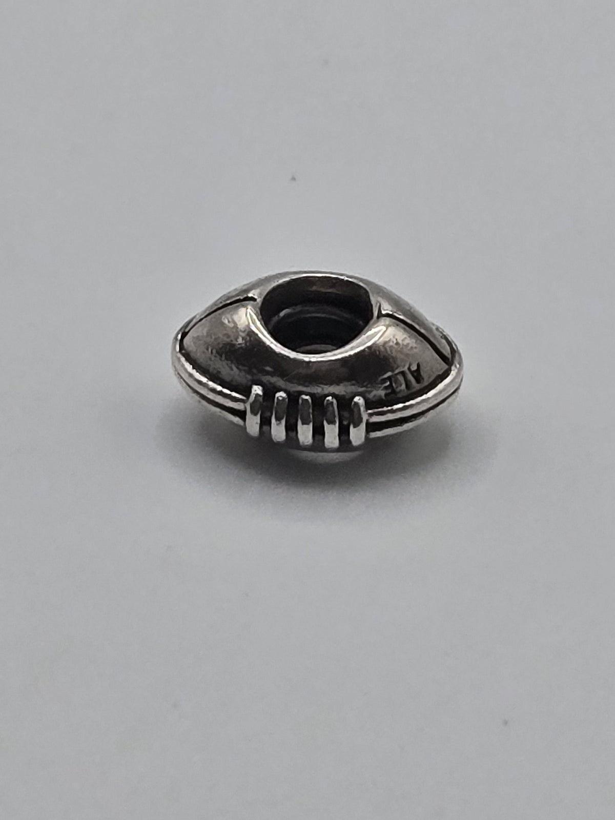 Pandora American Football Charm on a plain light background