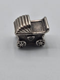 Pandora Baby Pram Charm on a plain light background