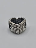 Pandora Beaded Heart Charm on a plain light background