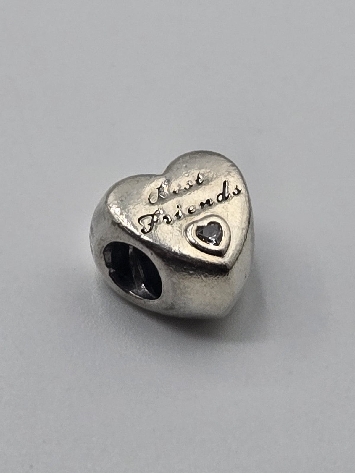 Pandora Best Friends Heart Charm on a plain light background
