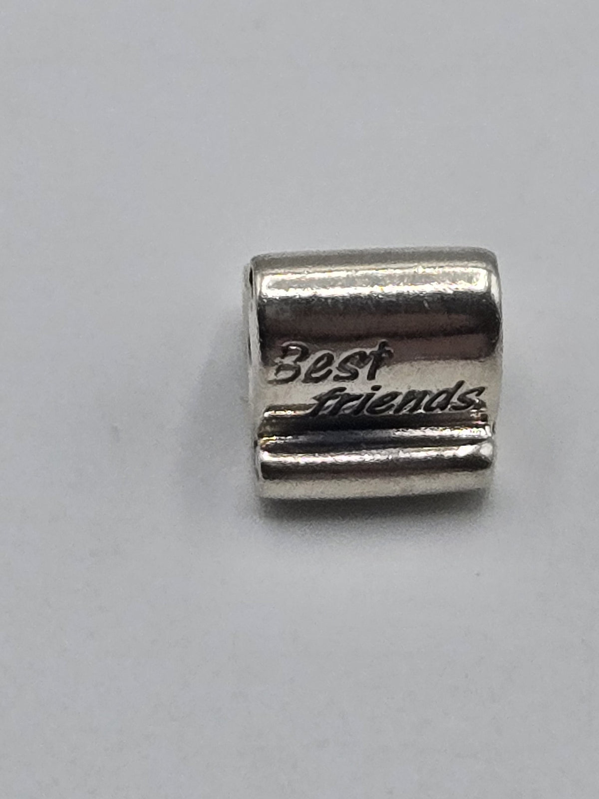 Pandora Best Friends Scroll Charm on a plain light background