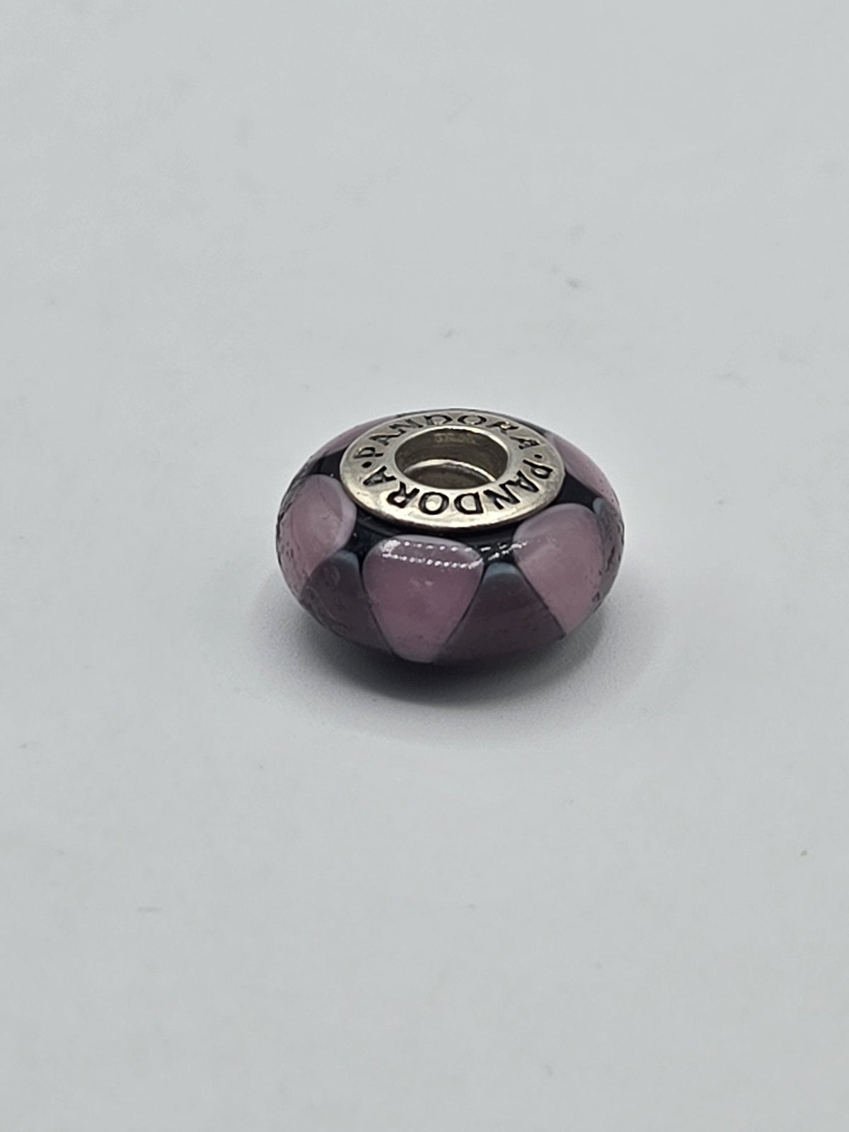 Pandora Black and Lilac Petal Murano Glass Charm on a plain light background