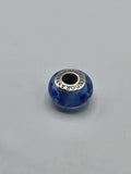 Pandora Blue Circle Murano Glass Charm on a plain light background