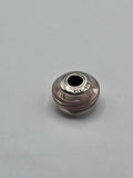 Pandora Blush and Gold Swirl Murano Glass Charm on a plain light background