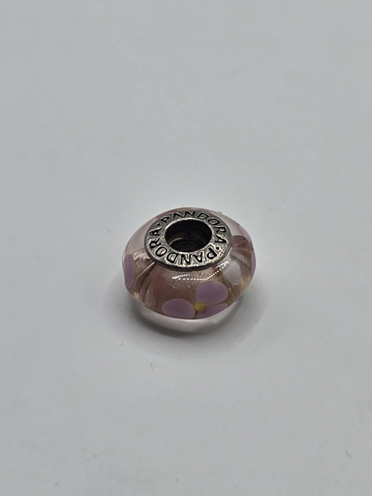 Pandora Blush Pink Lilac Flower Murano Glass Charm on a plain light background