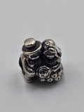 Pandora Bride and Groom Charm on a plain light background