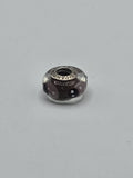Pandora Brown Pink and Black Polka Dot Murano Glass Charm on a plain light background