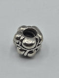 Pandora Bubbles and Rope Charm on a plain light background