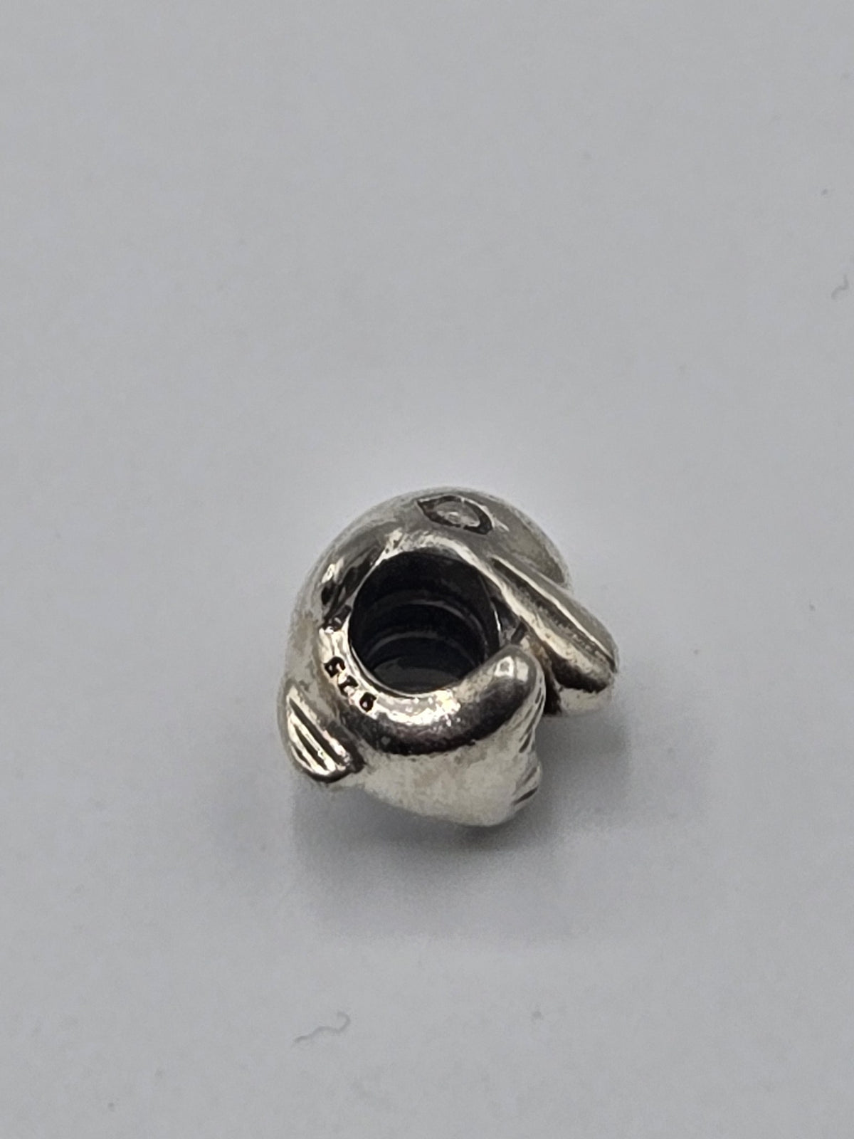Pandora Curled Elephant Charm on a plain light background