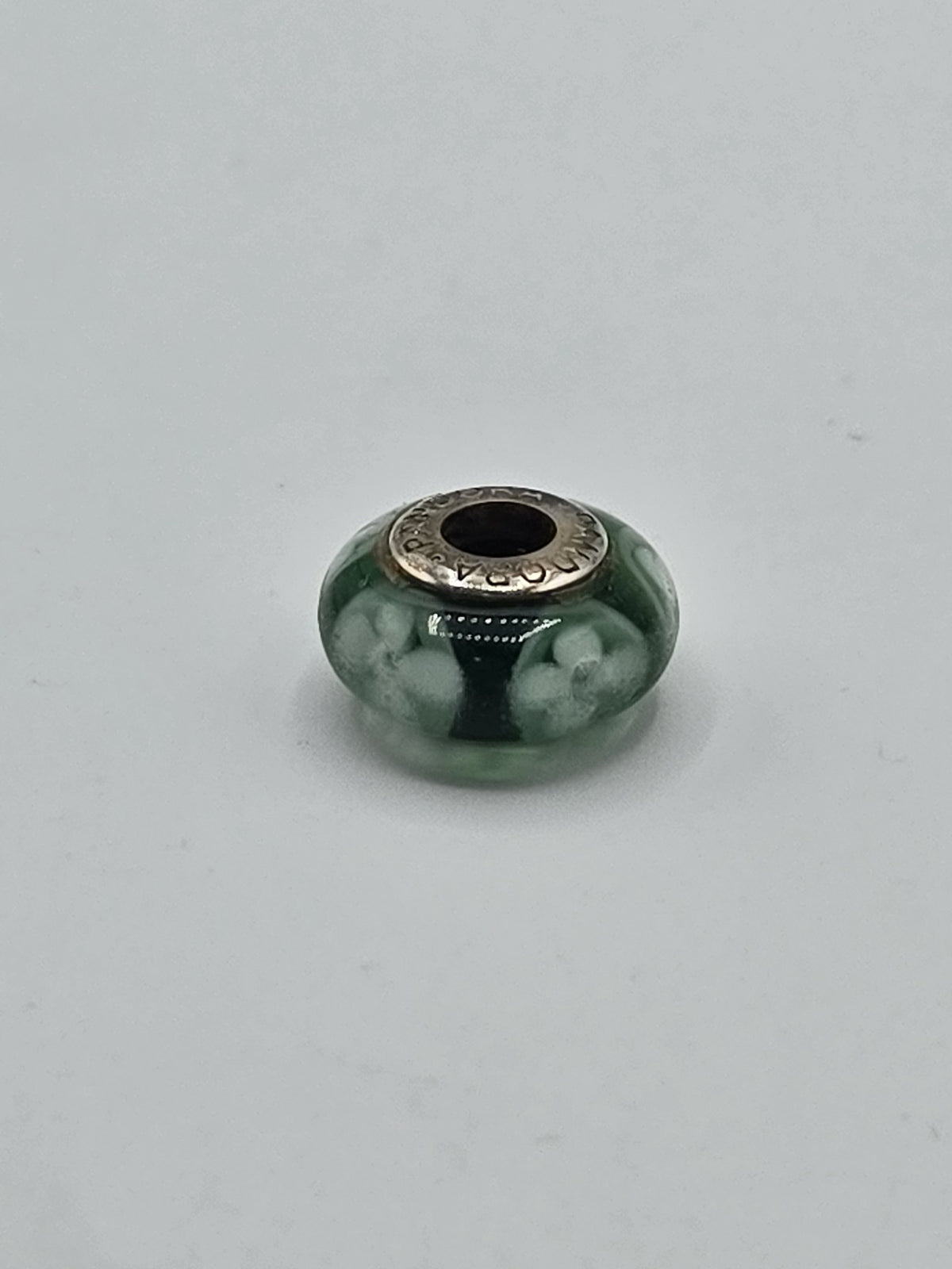 Pandora Dark Green White Blossom Murano Glass Charm on a plain light background