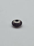 Pandora Deep Purple Faceted Murano Glass Charm on a plain light background