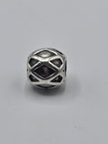 Pandora Diamond Pattern Charm on a plain light background