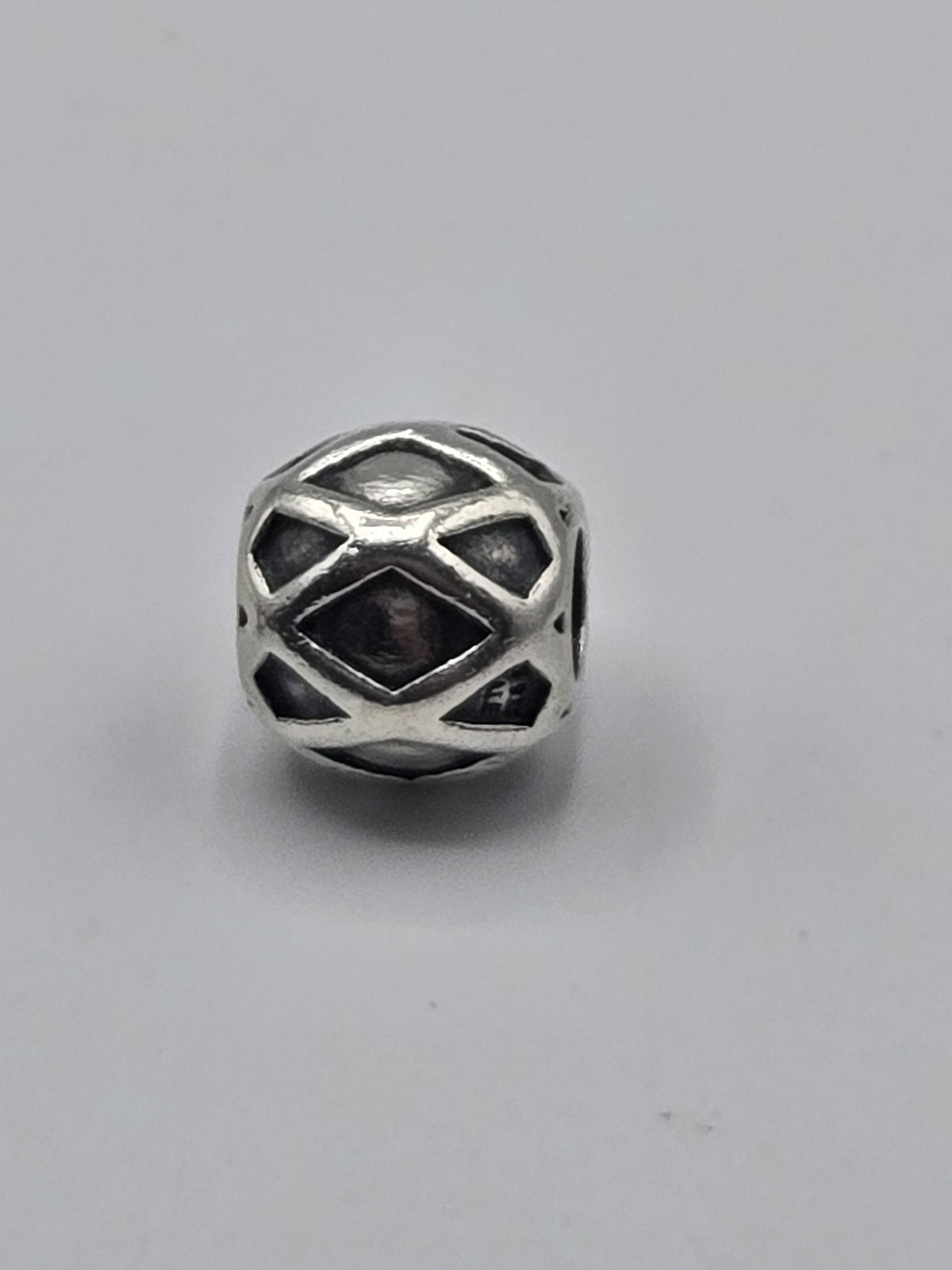 Pandora Diamond Pattern Charm on a plain light background