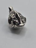 Pandora Fish Charm on a plain light background