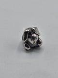 Pandora Floppy Eared Puppy Charm on a plain light background