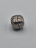 Pandora Floral Swirl Charm on a plain light background