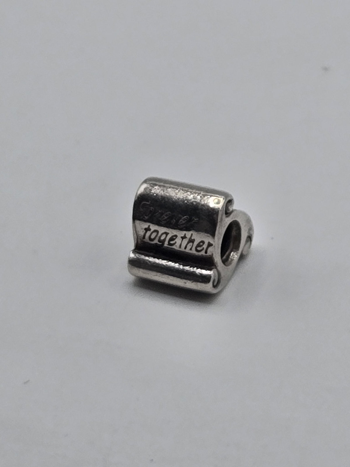 Pandora Forever Together Scroll Charm on a plain light background