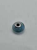 Pandora Frosted Turquoise Murano Glass Charm on a plain light background