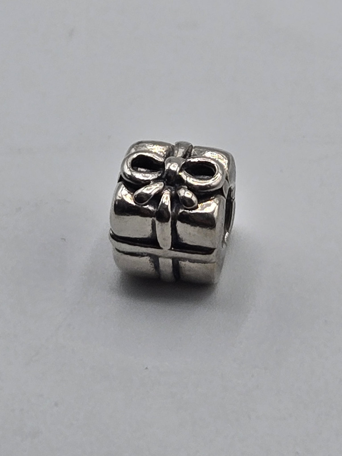 Pandora Gift Box Charm on a plain light background