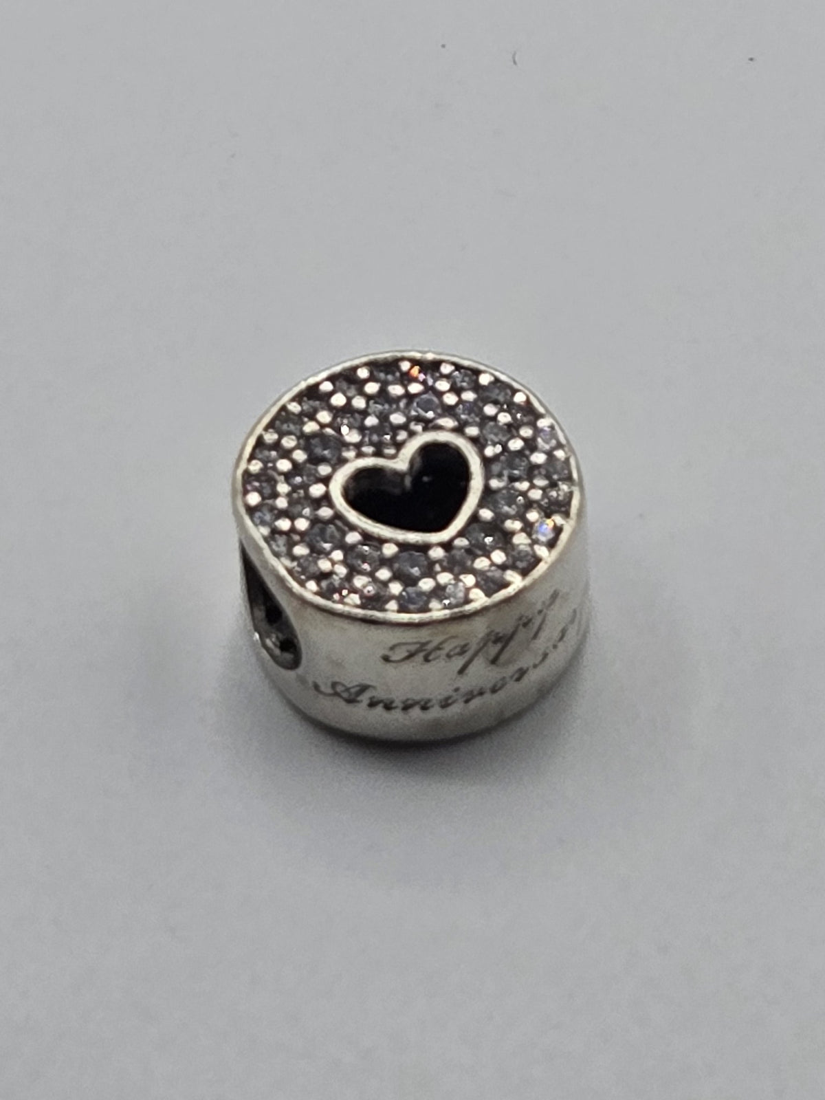 Pandora Happy Anniversary Charm on a plain light background