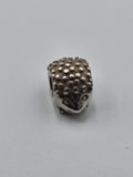 Pandora Hedgehog Charm on a plain light background