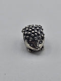 Pandora Hedgehog Charm on a plain light background