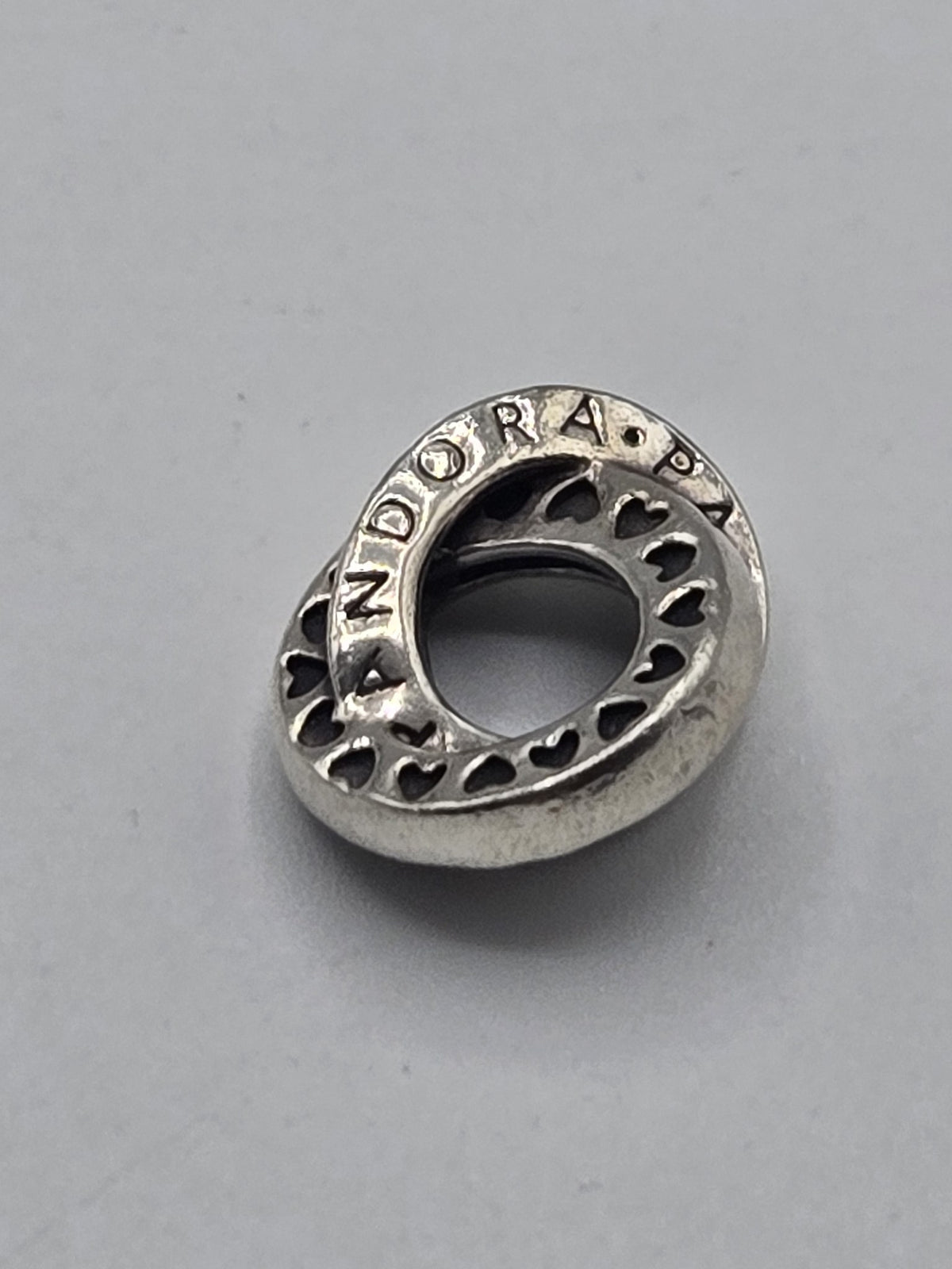 Pandora Interlocked Logo Circles Charm on a plain light background