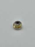 Pandora Lemon Yellow and Orange Dot Murano Glass Charm on a plain light background