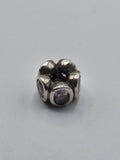 Pandora Lilac Stone Flower Charm on a plain light background