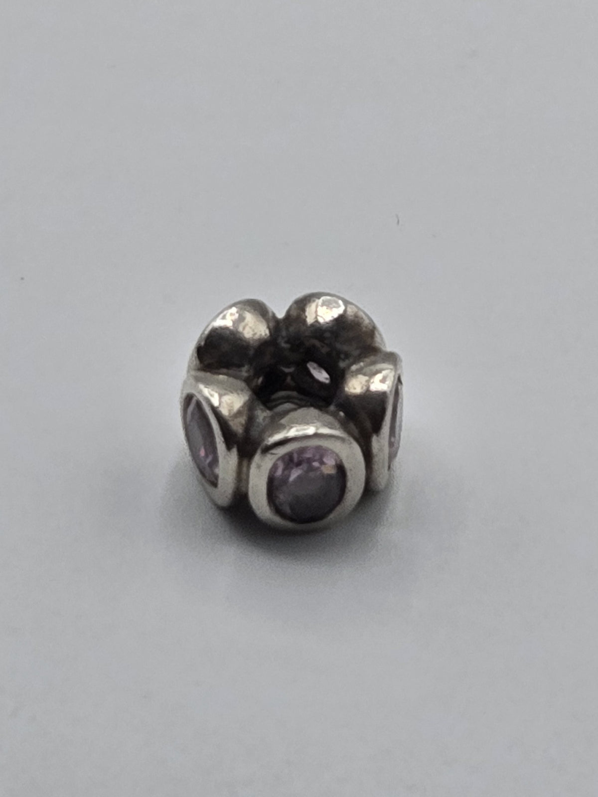 Pandora Lilac Stone Flower Charm on a plain light background