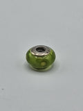 Pandora Lime Green Yellow Flower Murano Glass Charm on a plain light background