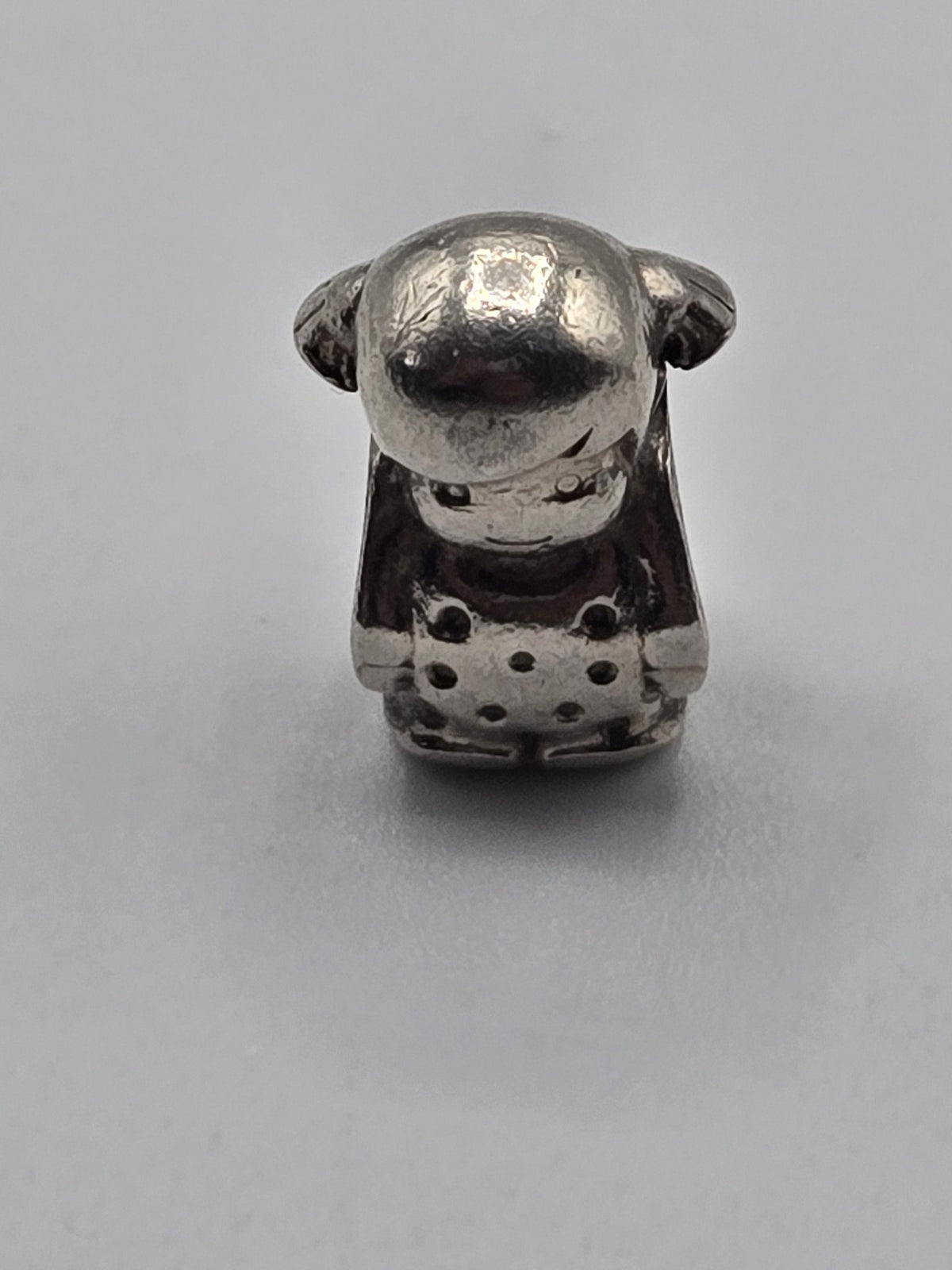 Pandora Little Girl Charm on a plain light background