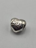 Pandora Love Languages Heart Charm on a plain light background