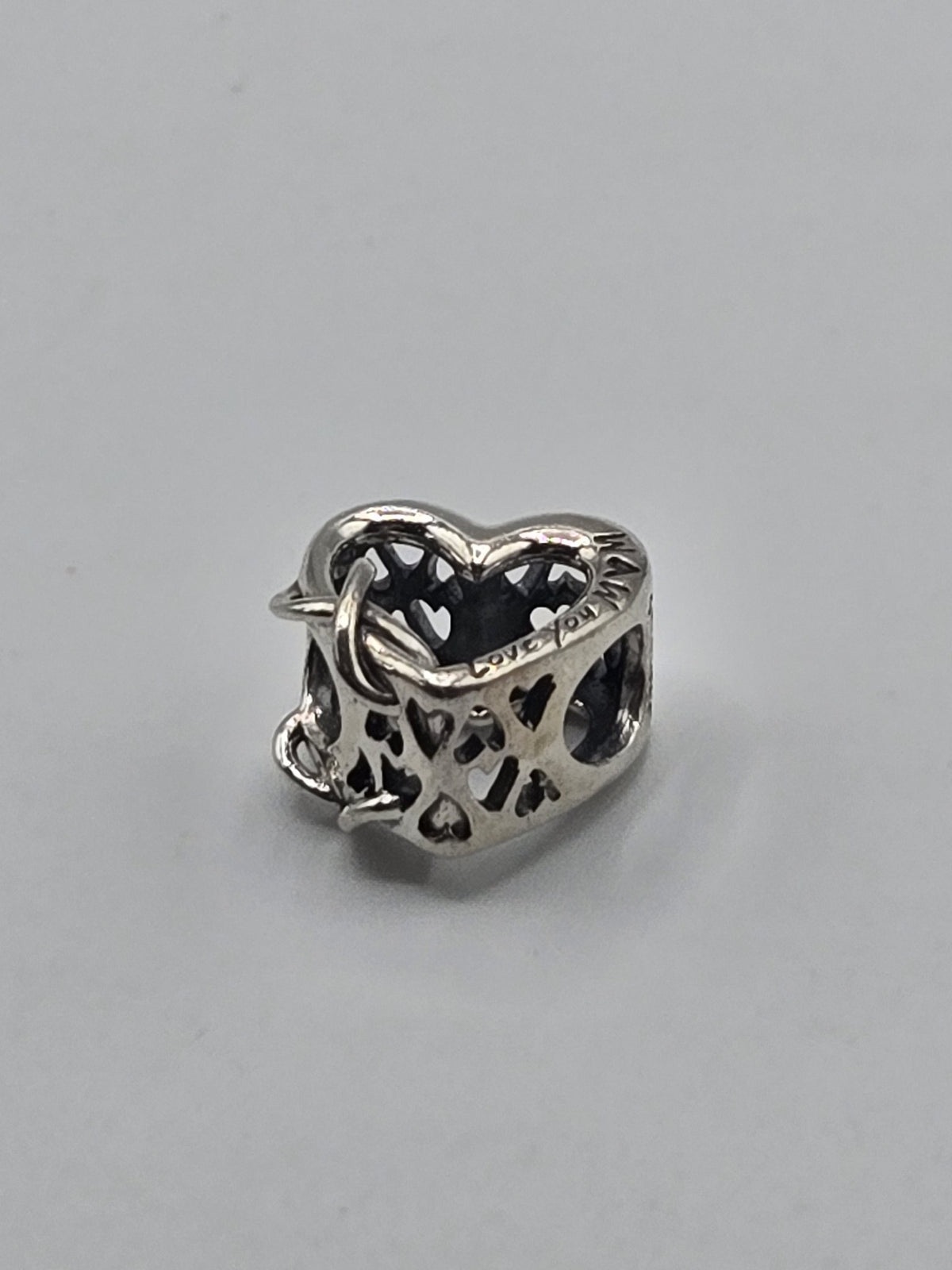 Pandora Love You Mum Heart Charm on a plain light background