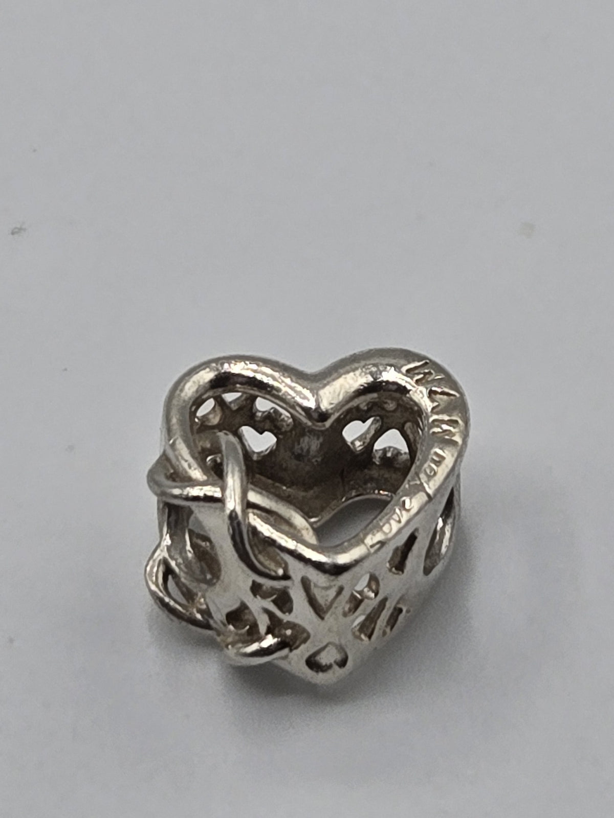 Pandora Love You Mum Heart Charm on a plain light background