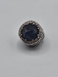 Pandora Midnight Blue Radiant Hearts Charm on a plain light background