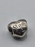 Pandora Mom in Many Languages Heart Charm on a plain light background