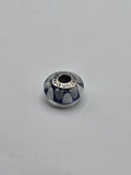 Pandora Navy and White Petal Murano Glass Charm on a plain light background