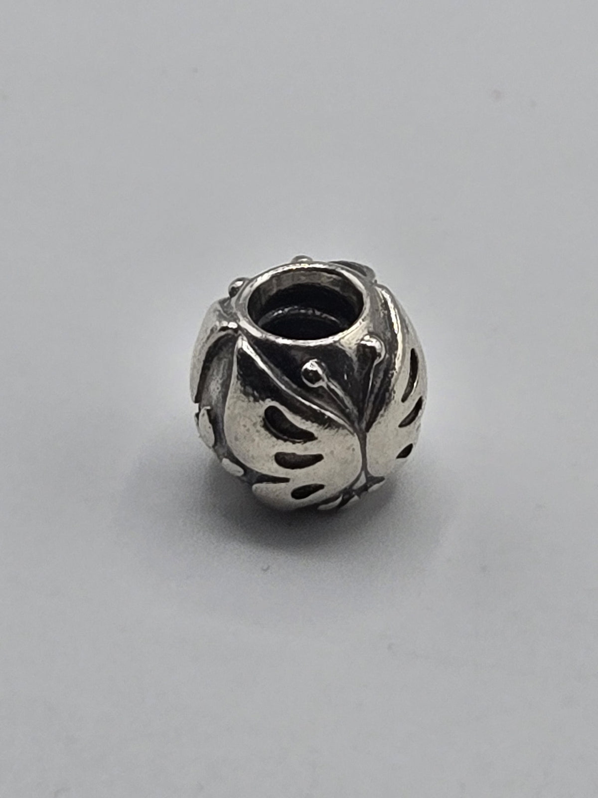 Pandora Openwork Leaf Charm on a plain light background