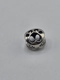 Pandora Openwork Paw Print Charm on a plain light background