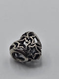 Pandora Openwork Stars Charm on a plain light background