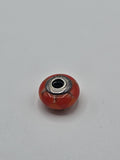 Pandora Orange-Red Heart Murano Glass Charm on a plain light background