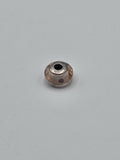 Pandora Pale Peach and Purple Dot Murano Glass Charm on a plain light background