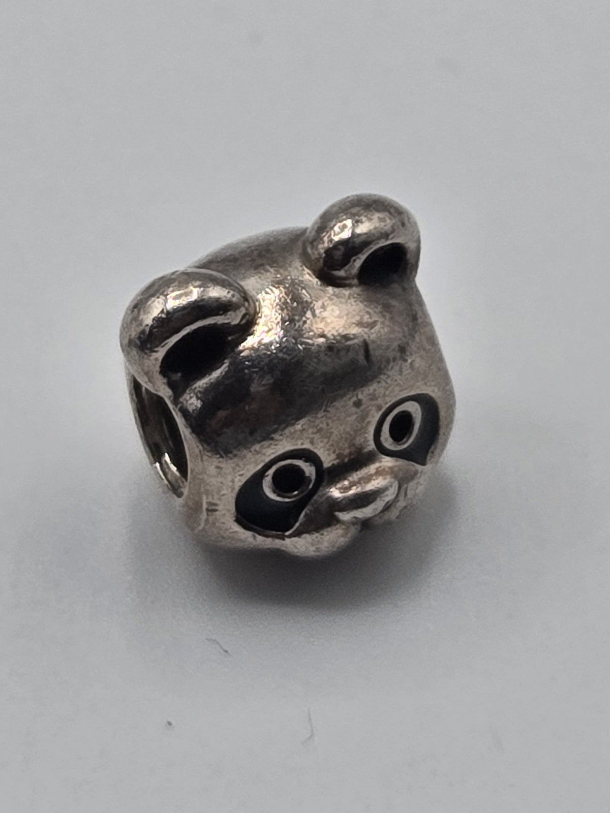 Pandora Panda Charm on a plain light background
